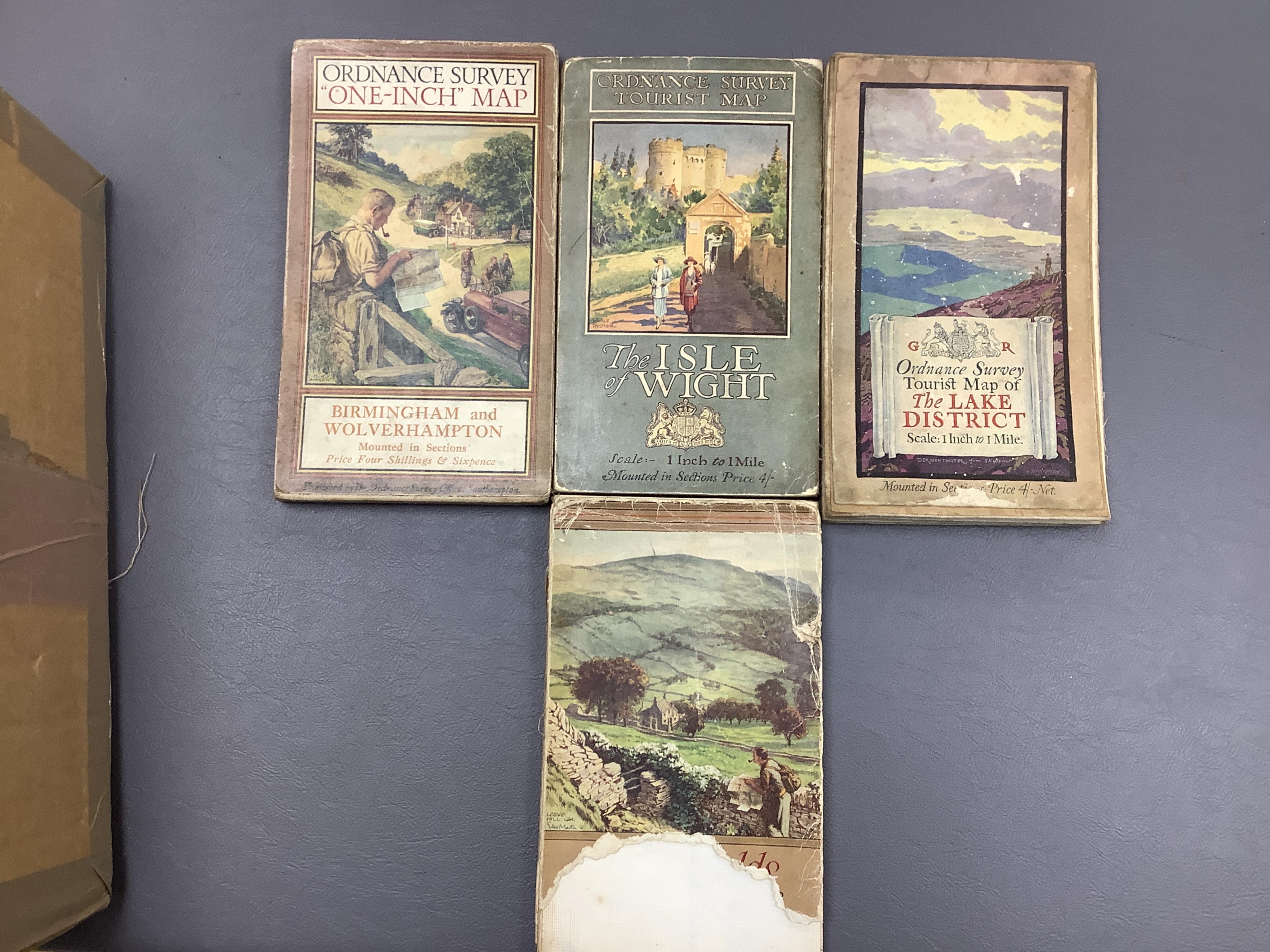 Twenty, one inch Ordnance Survey maps, together with thirty Ordnance Survey Tourist Maps, etc, 1920s/30s (50). Condition - poor to fair.